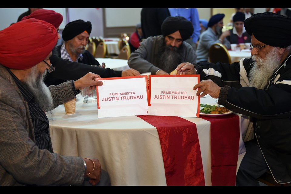 Supporters of Vancouver-South Liberal candidate Harjit Sajjan await election results, while celebrations for prime minister-elect Justin Trudeau get underway. Photo Dan Toulgoet
