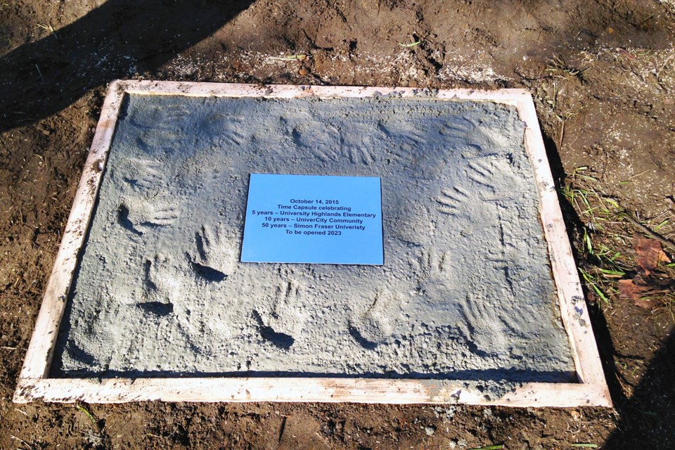 The concrete slab covering a time capsule buried at University Highland Elementary on Oct. 14 features a hand print from each of the school's current kindergarten kids.