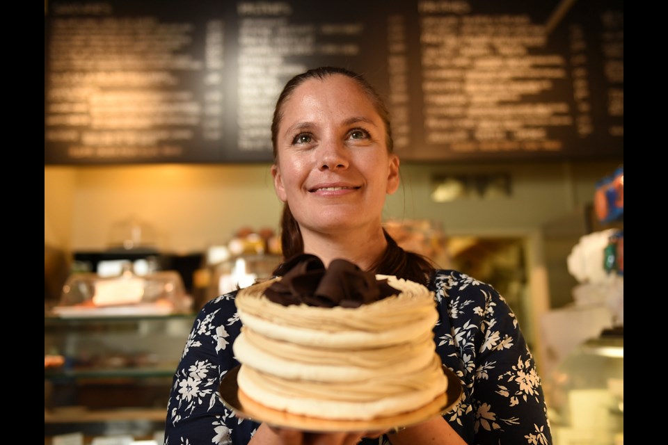 Sweet Obsession’s manager Andrea Thorgilsson shows off a mocha dacquoise. Photo Dan Toulgoet