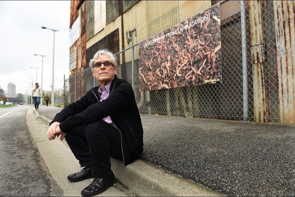 Al McWilliams is the artist behind a provocative worm sign at First Avenue and Cook Street. Photo Dan Toulgoet