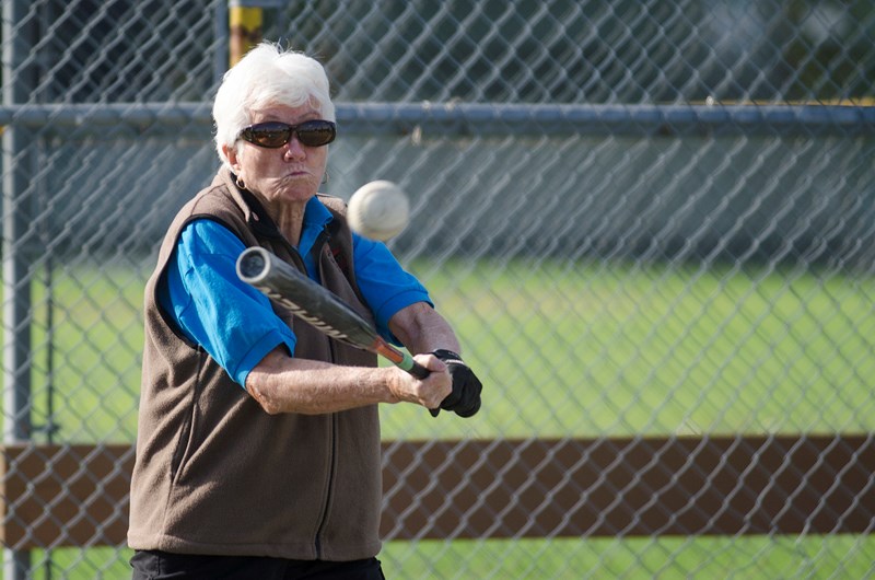Joan Dyer connects with a pitch at a B.C. Swingers practice at New Westminster's Moody Park recently.