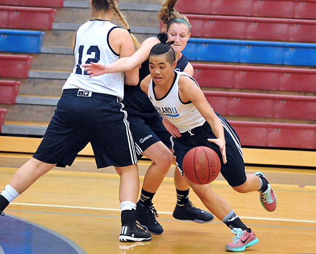 Point guard Ashley De La Cruz Yip of the Capilano women's basketball team drives the lane during a recent exhibition game. The Blues begin play in the PacWest league at home on Halloween night.