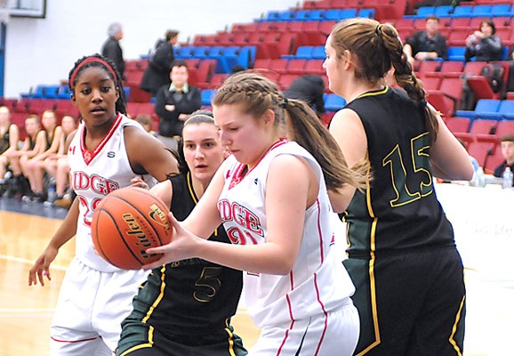 Argyle Pipers no. 5 (green ) Kristen Bourne battles against Maple Ridge Ramblers (white) at the 63rd Annual girls AAA Provincial Basketball Championships held at the Capilano University Sportsplex.