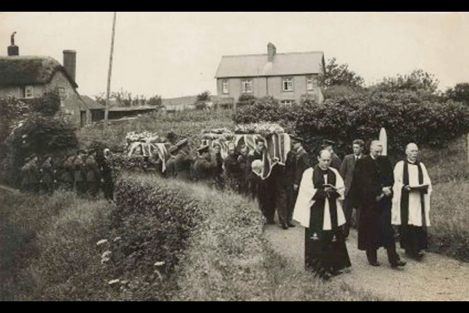 The funeral in August 1943 for the commanding officer of the RAF's 172 Squadron and his crew, who were killed when their plane exploded after takeoff. The funeral was at St. Augustine's churchyard at Heanton Punchardon, near the Chivenor air base in Devon, England.