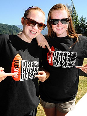 Seycove students Heather Murray and Maddie Thomson volunteer at one of the Deep Cove Daze entrances to accept donations for the annual festival.