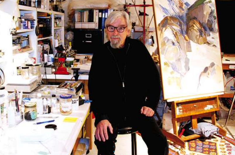 Art restorer Andrew Todd with a restoration project in his studio. photo: Louise Loik