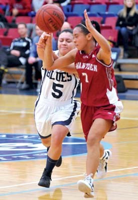 Capilano University women Blues #5 Jennafer Palma (white) and Kwantlen University Eagles #7 Jessica Villadiego battle for the ball at Capilano Sportsplex.