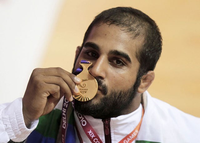 Olympic wrestler Arjan Bhullar with his 2010 Commonwealth gold medal.