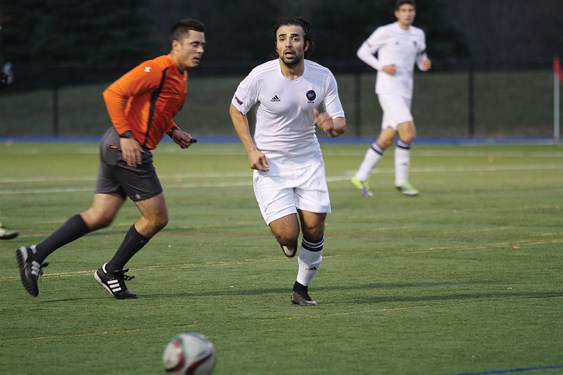 Kamyar Amini tracks down a ball during the CCAA national championships.
