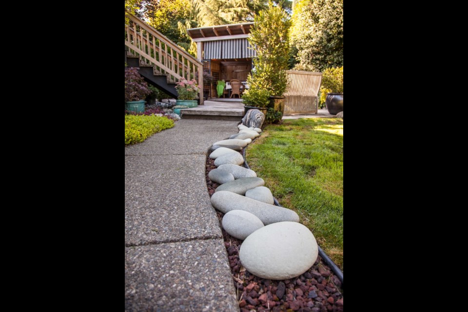 Miles Taylor edged a pathway with smooth, egg-like rocks that he collected on his travels to the Arctic.