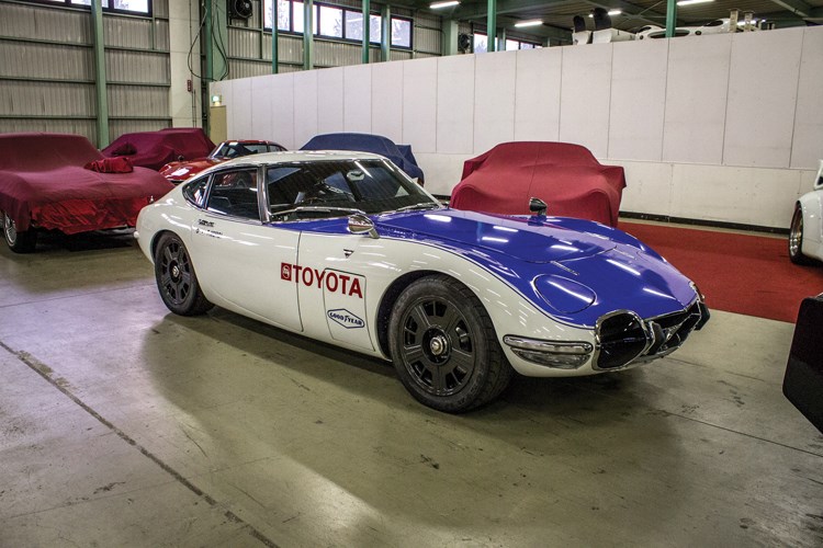 Tucked away above a factory near Gunma, Japan is a collection of Toyota 2000GTs, one of the rarest supercars on earth. The wildest of the bunch wears the racing colours of Carroll Shelby.