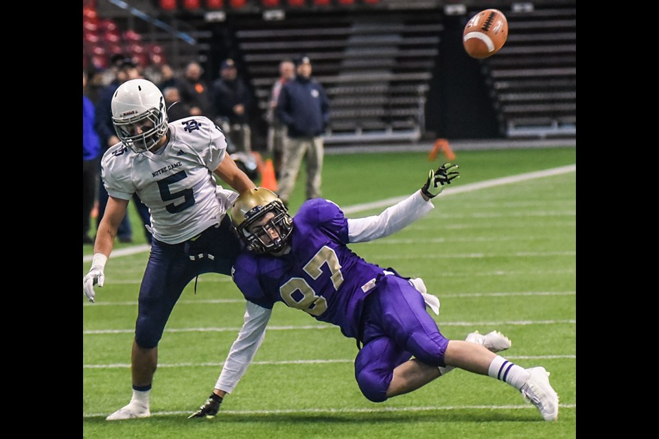 Vancouver College wide-receiver Aidan Fay (No. 87) battles Notre Dame corner back Adam Turrin (No. 5) in a 27-0 Fighting Irish quarter-final win at B.C. Place Nov. 21, 2015. Photo Rebecca Blissett