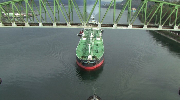 An oil tanker under tow through Burrard Inlet
