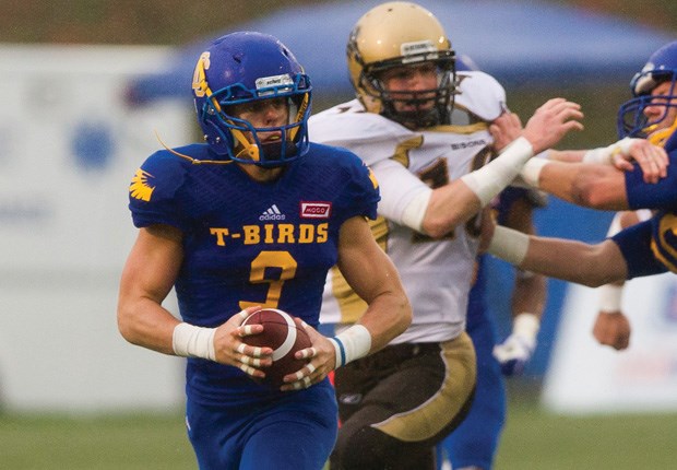 Mitch Barnett of the UBC Thunderbirds heads for the end zone after intercepting a pass in a recent playoff game. The upstart T-Birds, featuring several North Shore players, will play for the Vanier Cup Saturday.