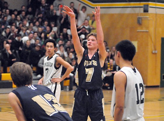 Windsor Dukes (white) were the victors in AA Howe Sound Tournament Championship game against Collingwood Cavaliers (blue) .Collingwood's no. 7 Jack Campbell free throws.