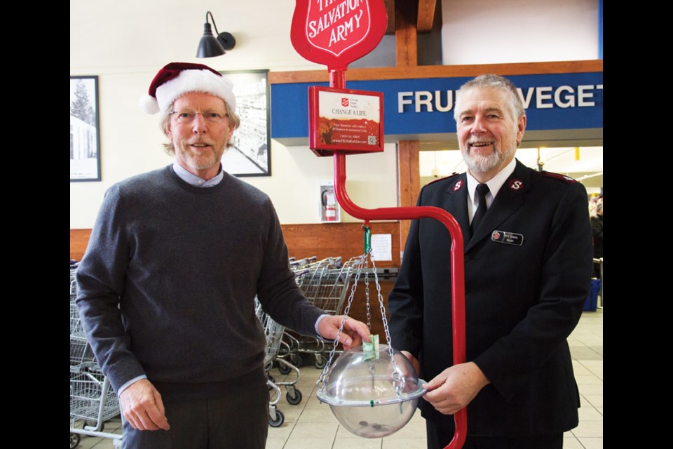 Sechelt Mayor Bruce Milne and Major Dale Sobool, pastor of the Sunshine Coast Salvation Army, were at the kick off for the annual kettle campaign at Trail Bay Mall on Nov. 21.