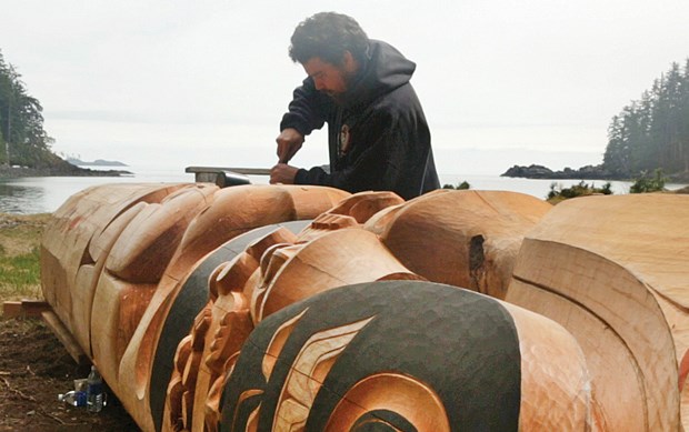 Jaalen Edenshaw carves Gwaii Haanas Legacy Pole at the Haida Heritage Centre at Kaay Llnagaay.