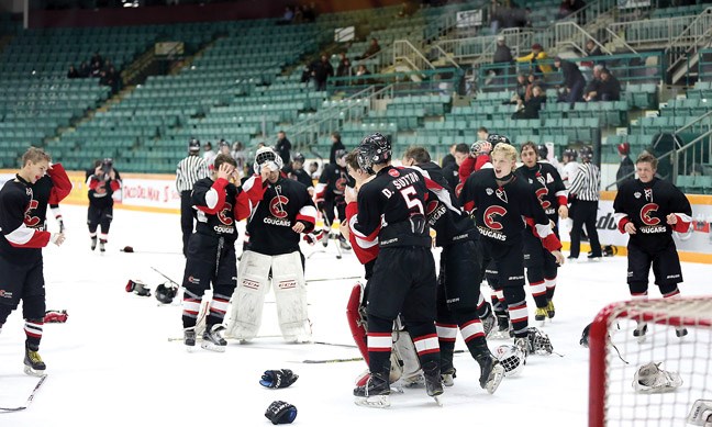 The Coast Inn of the North Cougars celebrate winning the Prince George Midget Tier 1 tournament with a 5-1 victory over OHA Edmonton on Sunday at CN Centre.