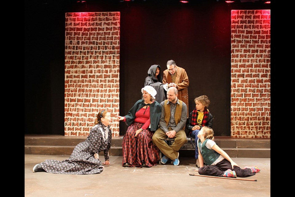 Inspecting Carol features (front, from left) Deborah Merrick, Diane Tzingounakis, Richard Wiens, James Hughes and Veronica Berg with (in back) Wynn Siu and Sheldon Landry. The Vagabond Players production is onstage until Dec. 19.