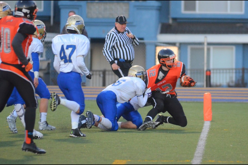 New Westminster's Lucas Sabau stretches out for the goal line during a successful run last week in the B.C. junior AAA football semifinal against Seaquam.