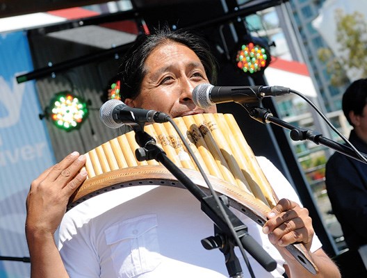 Edgar Muenala plays the pan flute.