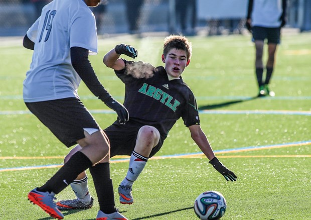 Miles Gailiunas of the Argyle Pipers senior boys soccer team slides in for a challenge during the AAA provincial championships held last week in Burnaby. The Pipers scored silver with a starting lineup that featured four Grade 10s and Gailiunas, who is in Grade 9.