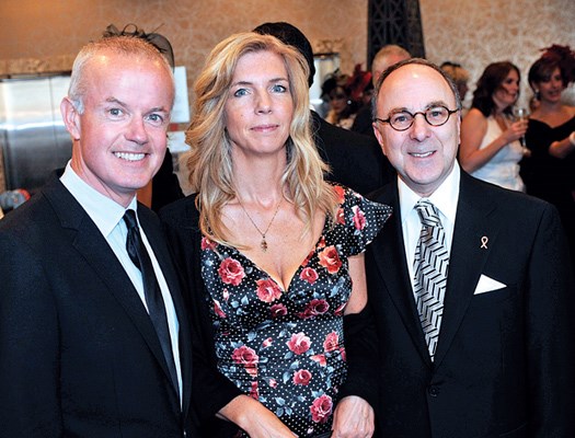 Event auctioneer Gary Jones and wife Meg, and guest speaker Martin Donner, a senior partner of Borden Ladner Gervais, team up for a photo.