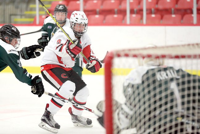 Colton Thomas of the Cariboo Cougars fires a backhand shot on North Island Silvertips Derek Krall on Saturday at Kin 1. The Silvertips were in town to take on the Cougars in regular season BC Major Midget League hockey action. Citizen Photo by James Doyle December 12, 2015