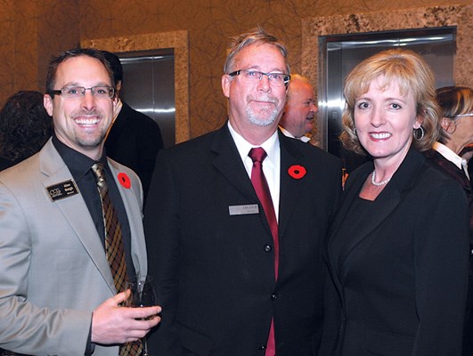 North Shore Credit Union's Alan Haigh, Digby Leigh and Western Stevedoring's Jeanette O'Brien have a chat.