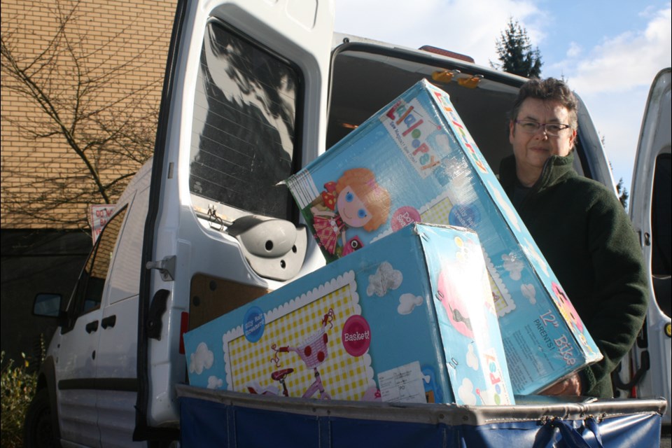 Heather MacKay volunteers to drive toys to the Burnaby Christmas Bureau’s toy room on Kingsway, She also helps by delivering holiday hampers to seniors and people in need.