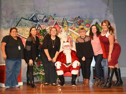 Meeting Santa were Sea Island Community Association board members, from left, Renee Robinson, Julieanne Wazir, Hayley Atkinson, Regina Vychodilova, Stephanie Monaghan and Karen Parker.