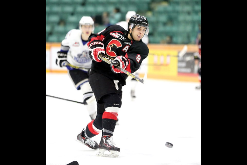 Chase Witala of the Prince George Cougars fires a shot on net against the Victoria Royals on Friday at CN Centre. The Royals were in town to take on the Cougars in the first game of a weekend double header with the same two teams meeting Saturday night for the annual Teddy Bear Toss game. Citizen Photo by James Doyle December 18, 2015