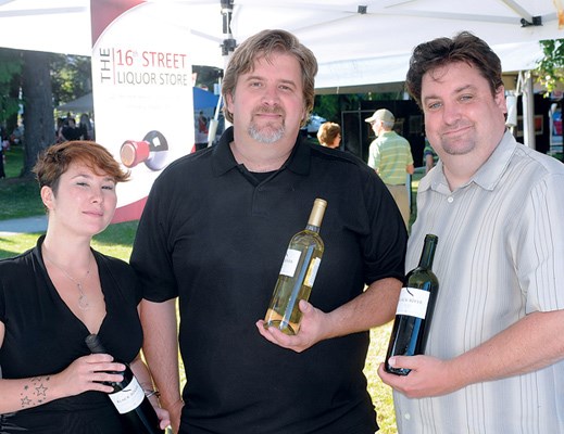 The 16th Street Liqour Store's Jenn Wurko (left),Chris Funnell and Paul Watkin were the wine sponsors for the Harmony Art's opening reception.