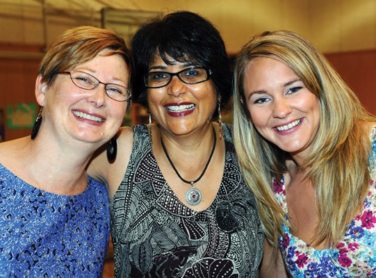 Event organizers Glenda Kopperson, Neelam Malik and Kami Tiveron greet guests.