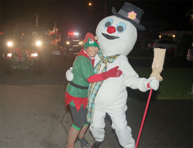 An elf meets a snowman during last year's revival of the Steveston Santa Parade
