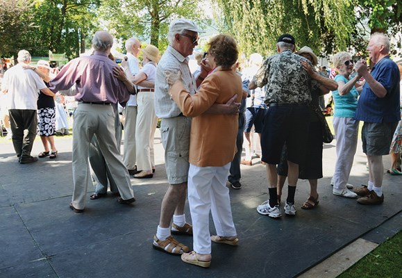 Couples dance to the sounds of the Dal Richards Orchestra on an outdoor dance floor along West Vancouver's waterfront.