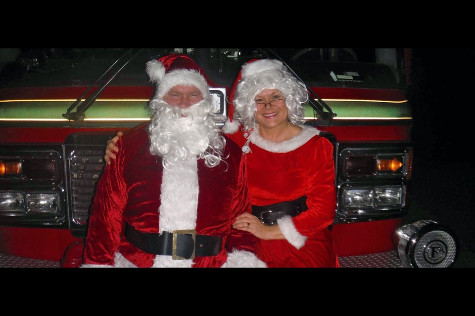 Santa and Mrs. Claus took part in a caroling and food collecting event on Monday for Share Family and Community Services.
