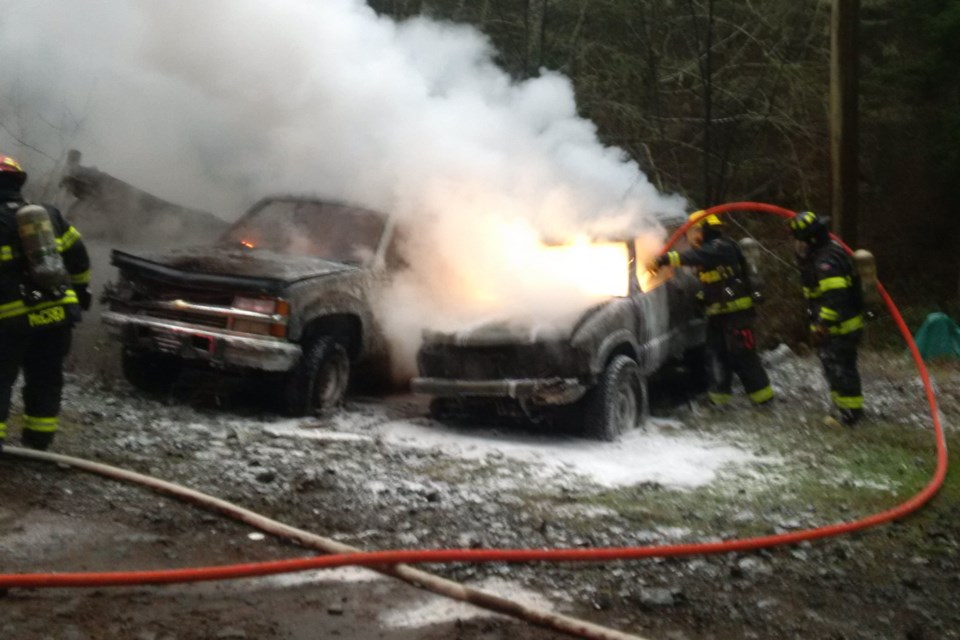 Sooke firefighters put out flames in two burning vehicles.