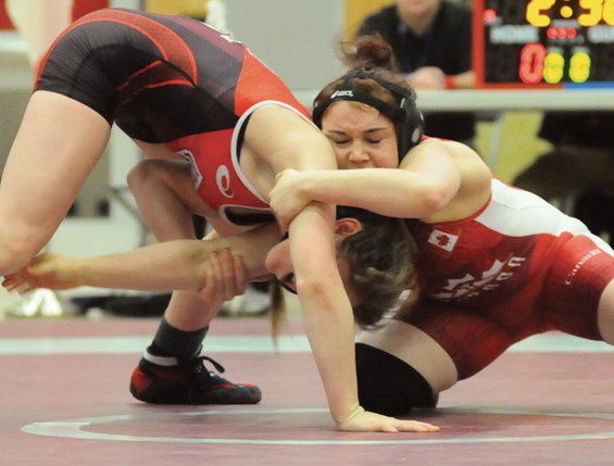 SFU's Abby Lloyd takes on Ronna Heaton during a dual meet pitting B.C. wrestlers against members of the U.S.A. cadet girls national team. photo by Cindy Goodman, North Shore News