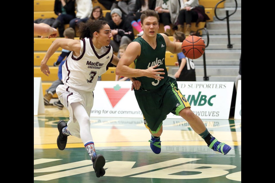 UNBC Timberwolves Marcus MacKay drives hard to the net against MacEwan University Griffins Thadius Galvez on Saturday at Northern Sport Centre. Citizen Photo by James Doyle January 9, 2016