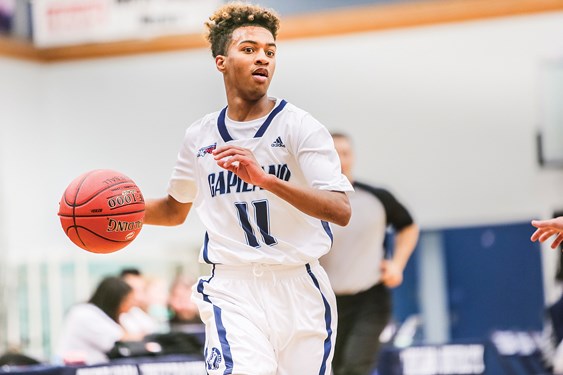 Brendan Bailey of the Capilano Blues brings the ball up during a recent PacWest game. Bailey had a huge game in a win over the Langara Falcons Saturday, leading the Blues with 25 points, eight rebounds and four assists.