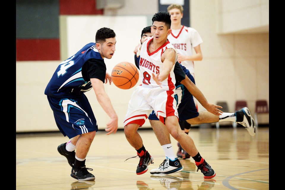 Holding off two Fleetwood Park defenders, St. Thomas More's EJ Escobedo makes a break for open floor during Saturday's STMC Chancellor tournament.