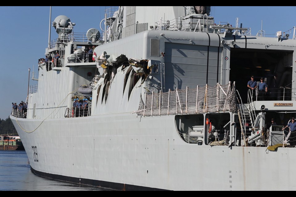 Damage to HMCS Algonquin is evident after a collision with HMCS Protecteur during a 2013 exercise.