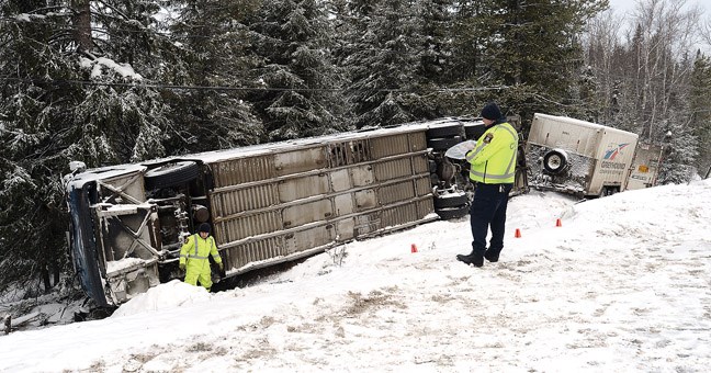 CVSE inspect a Greyhound bus that crashed five kilometres north of Hixon on Thursday just before 8 a.m.