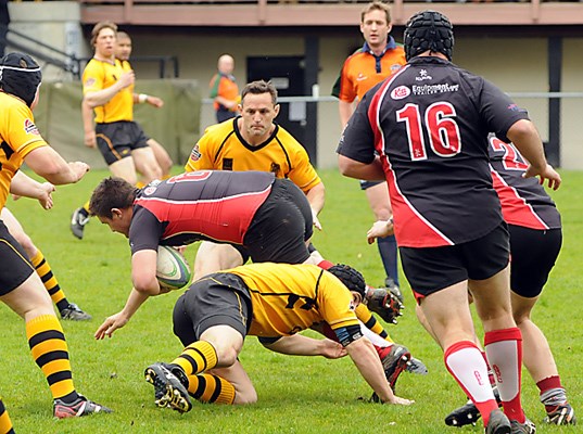 Capilano Rugby Club premier men (yellow) in action against Abbotsford at Klahanie Park.