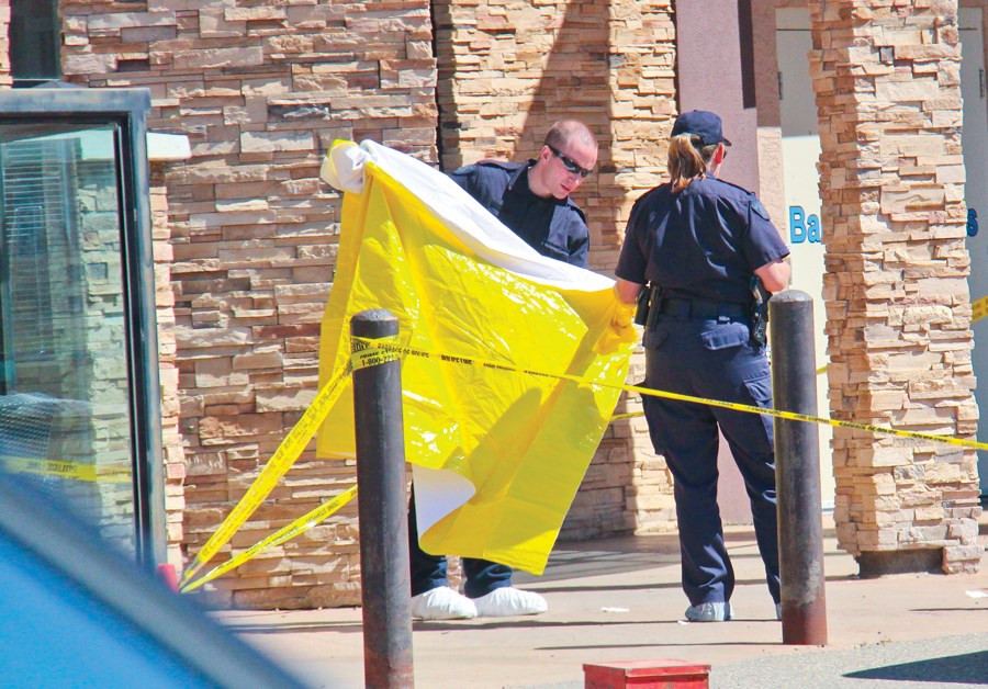 Officers contain the scene outside a Dawson Creek restaurant where James McIntyre was shot dead by police July 16.
