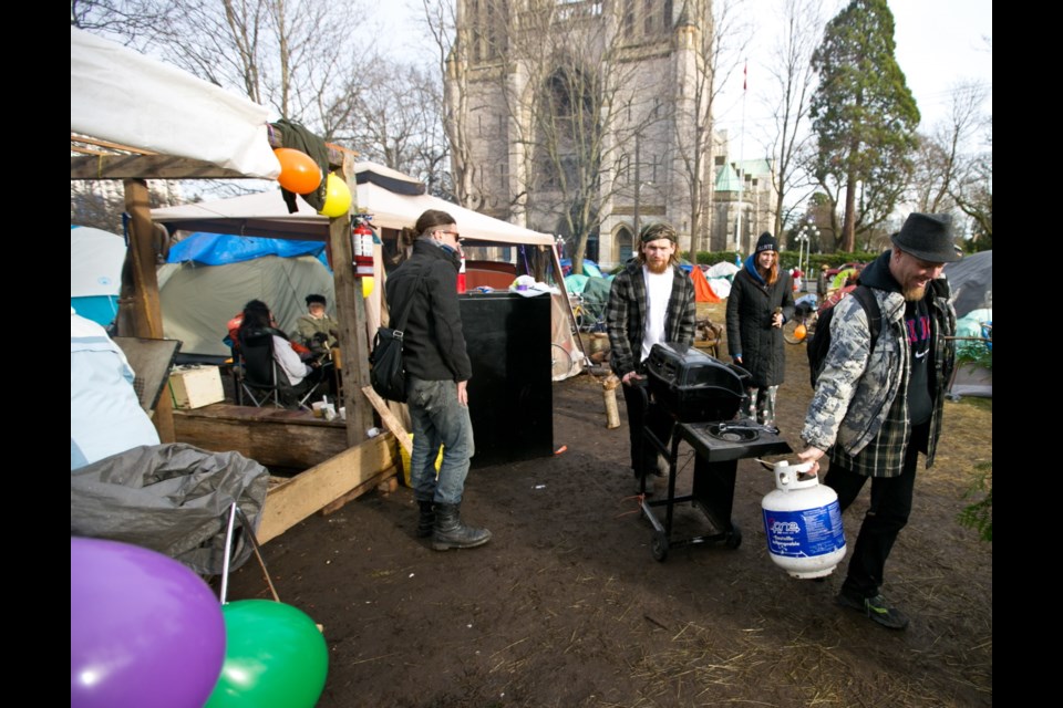 The growing tent city, across from Christ Church Cathedral on Quadra Street, bustles with activity on Saturday, Jan. 16, 2016.