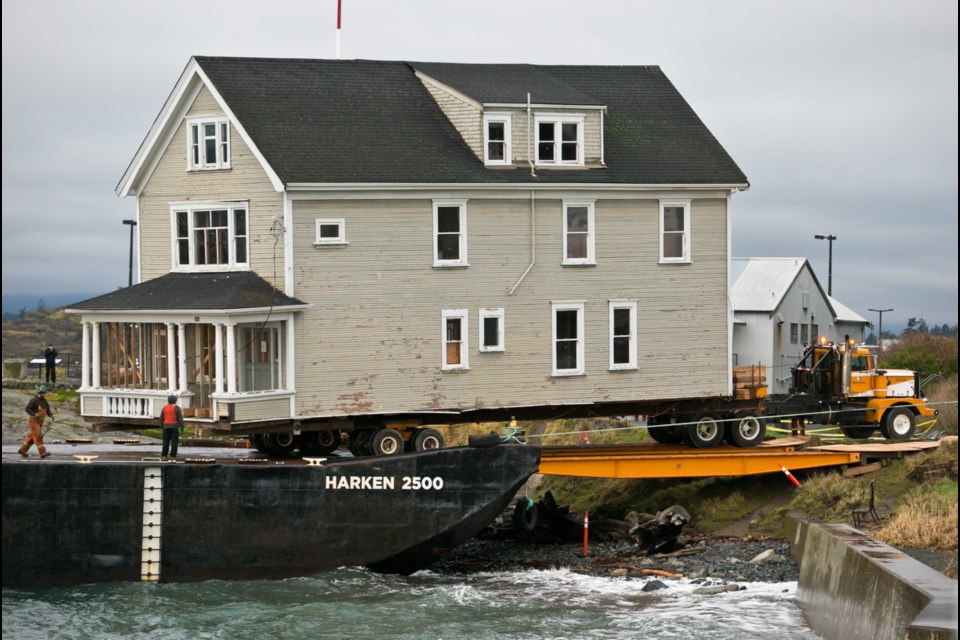 House is unloaded from barge at Ogden Point.