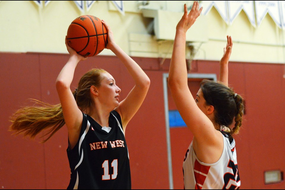 New Westminster's Rhiannon Liedl looks to pass during second round action at last week's Centennial Top-10 senior girls basketball tournament.