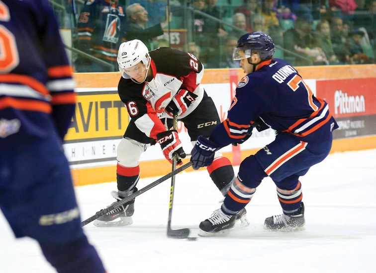 Prince George Cougars Kody McDonald battles for control of the puck against Kamloops Blazers Gage Quinney on Friday at CN Centre. The Blazers were in town to take on the Cougars in the first game of a weekend doubleheader, with both teams meeting again on Saturday. Citizen Photo by James Doyle January 22, 2016